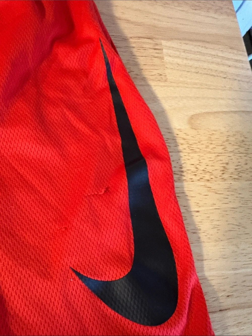 Nike Red Mesh Sports Shorts with Black Swoosh